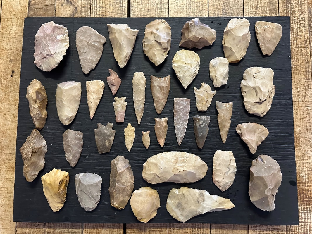 Collection of ancient stone arrowheads and tools found on the South Texas ranch